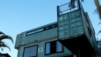 Modern shipping container home in Vila Baependi, Brazil, showcasing creative architecture.