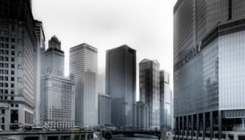 Stunning view of Chicago's skyscrapers along the river with a yellow water taxi.
