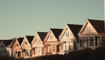 Sunlit Victorian houses known as the Painted Ladies in San Francisco, California.